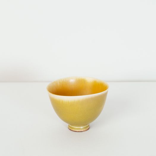 Miniature yellow bowl on foot thrown by Berndt Friberg