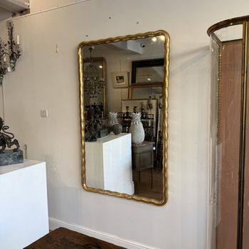 Large French wavy edge gilt mirror