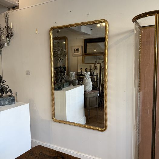 Large French wavy edge gilt mirror