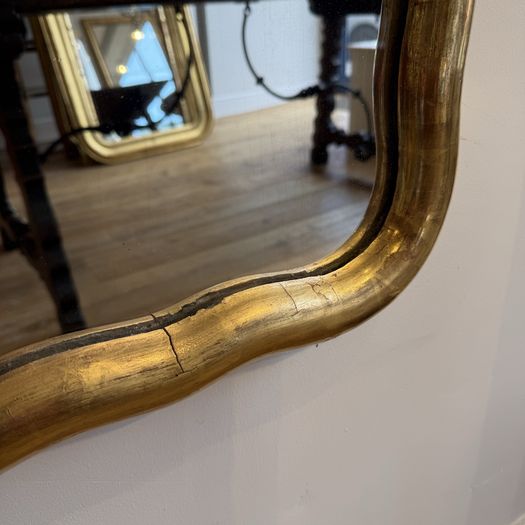 Large French wavy edge gilt mirror
