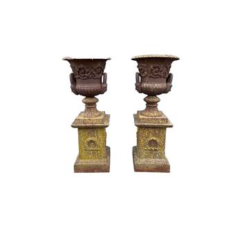 Pair of 19th century cast iron campagna urns on bases
