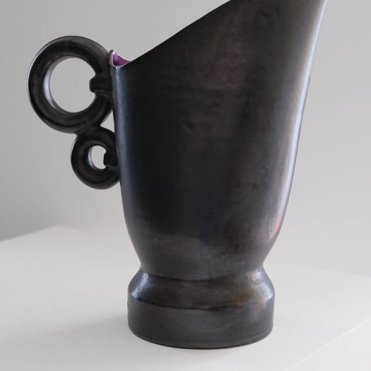 A Black Ceramic Jug
