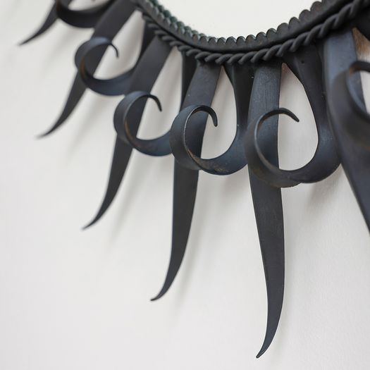 A Black Iron Sun Mirror