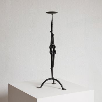 A Wrought Iron Candlestick