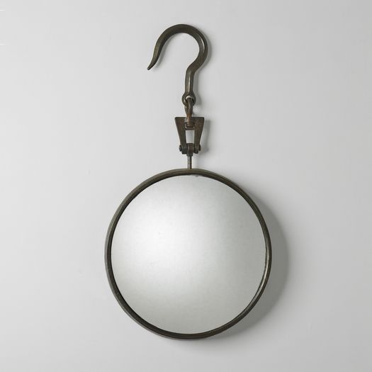 A Circular Steel Mirror