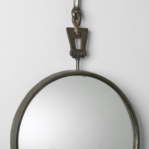 A Circular Steel Mirror