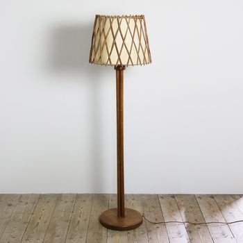 An Oak Floor Lamp with Rattan Shade