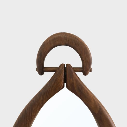 An Oval Wooden Mirror