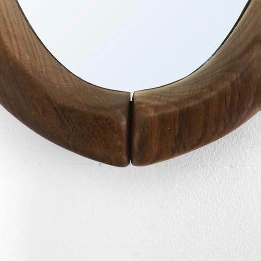 An Oval Wooden Mirror