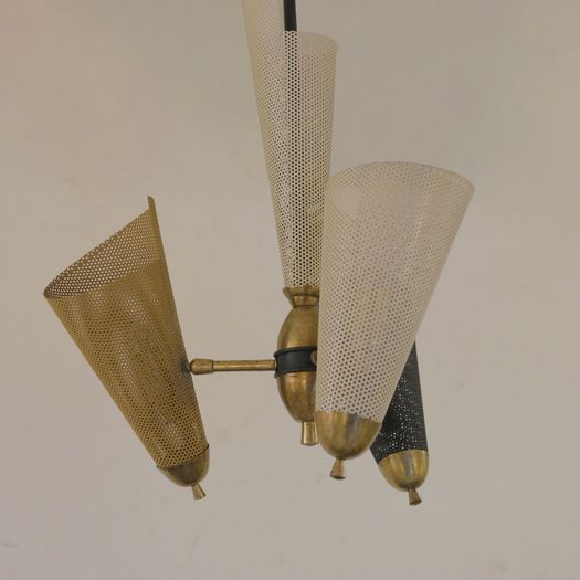 A Perforated Metal Pendant Light