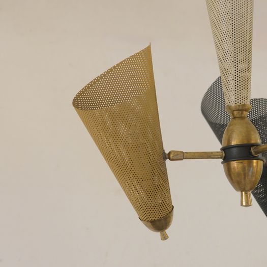 A Perforated Metal Pendant Light