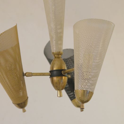 A Perforated Metal Pendant Light