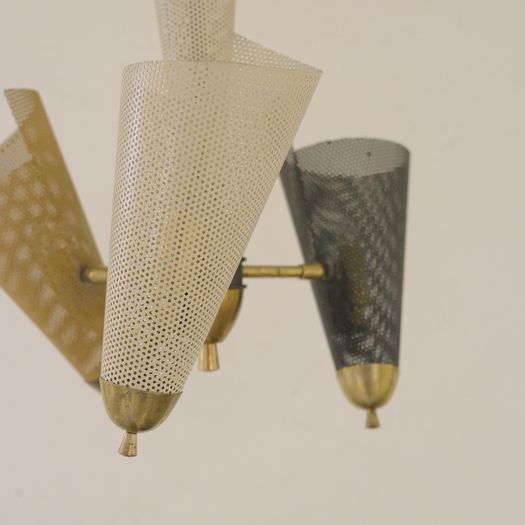 A Perforated Metal Pendant Light