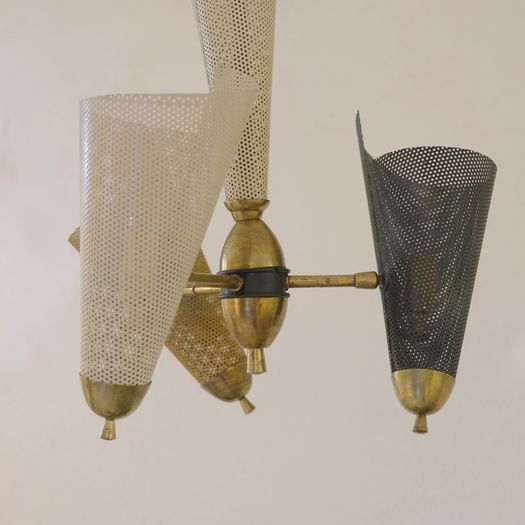 A Perforated Metal Pendant Light