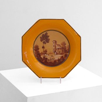 A Yellow Ceramic Charger