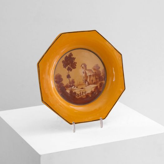 A Yellow Ceramic Charger