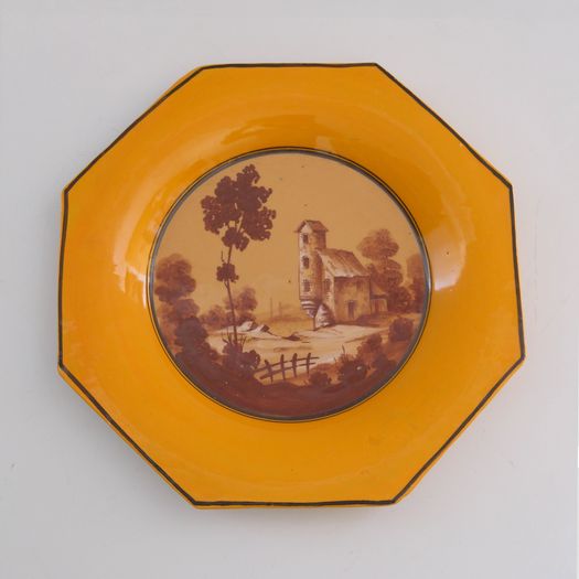 A Yellow Ceramic Charger