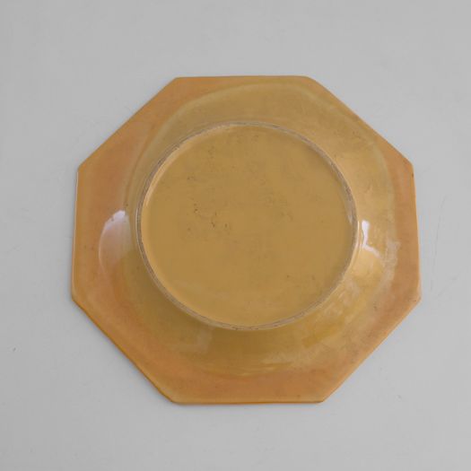 A Yellow Ceramic Charger