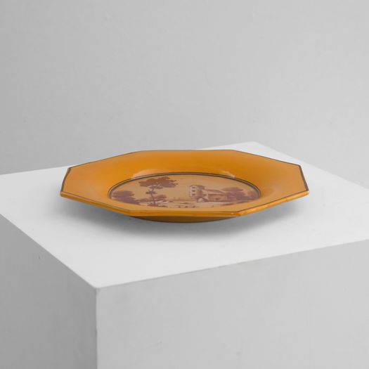 A Yellow Ceramic Charger