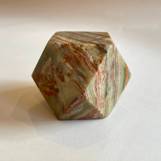 An Onyx Tetradecagon Desk Ornament