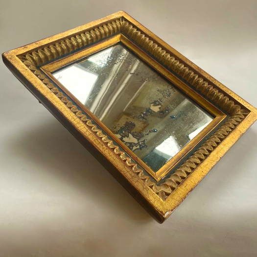 A Small Mirror in Gilt Frame