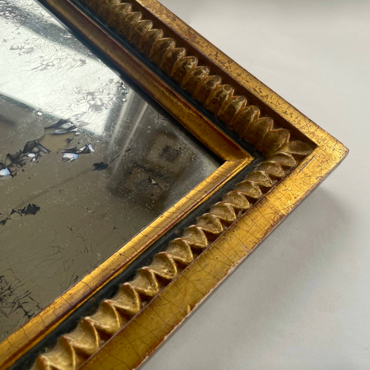 A Small Mirror in Gilt Frame